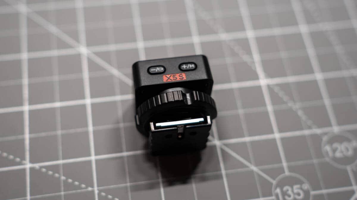 Front lens assembly featuring xenon flash tube and integrated LED modeling light
