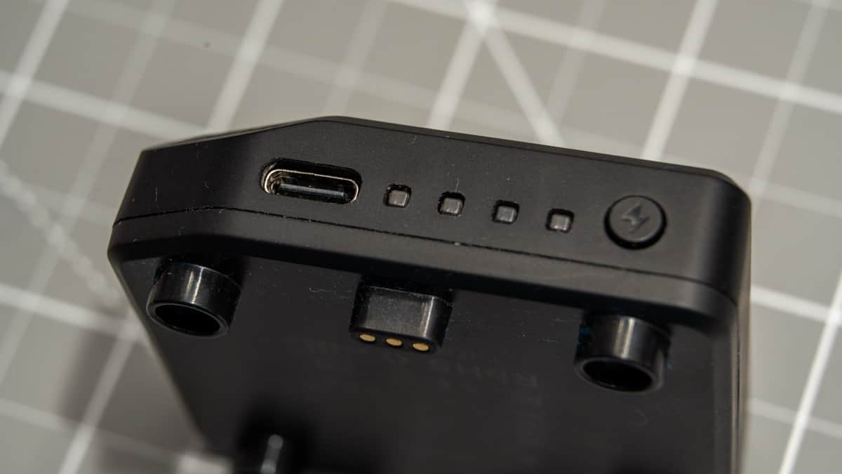 Detachable 3,000mAh battery pack showing USB-C port, 4-stage LED gauge, and power check button