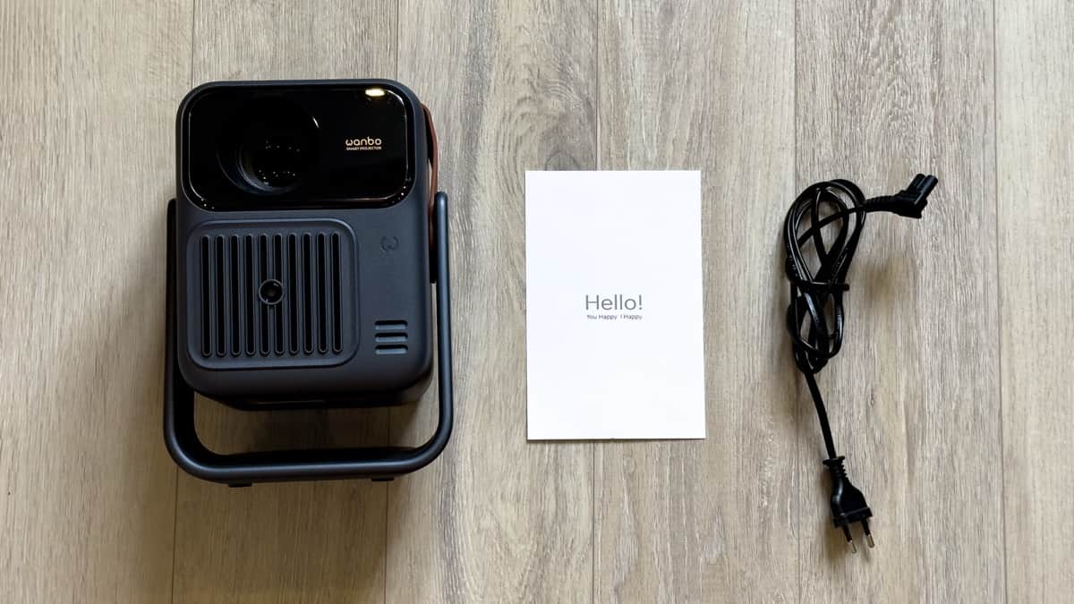 Wanbo ToGo Pro complete retail kit contents including projector unit, standard 1.5m AC power cable, and user documentation