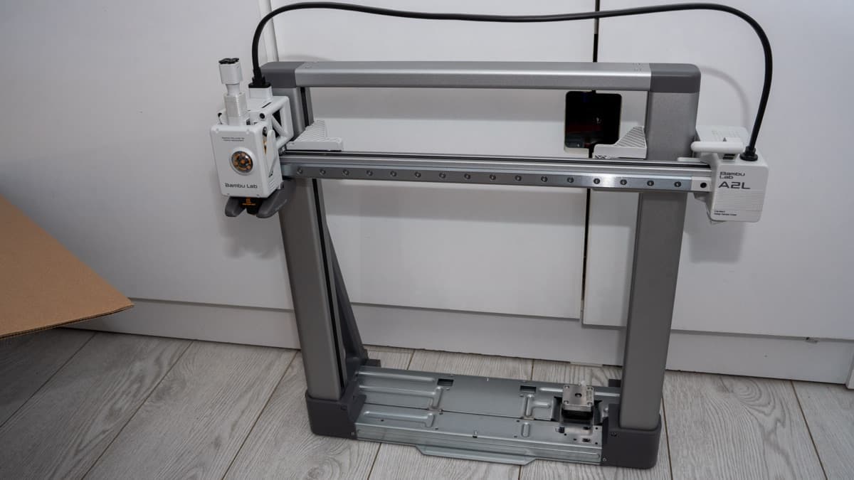 Mating the vertical gantry extrusions to the heavy aluminum base chassis