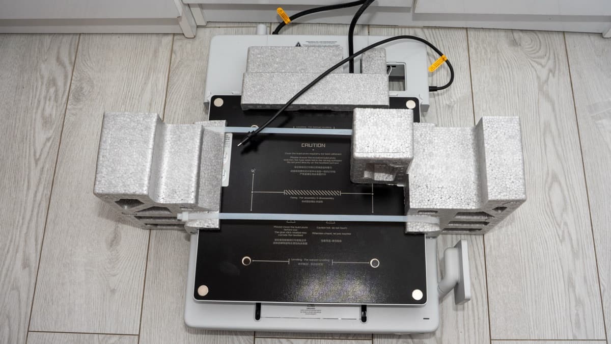 Heavy cast aluminum base unit and Y-axis carriage safely cushioned in shipping foam