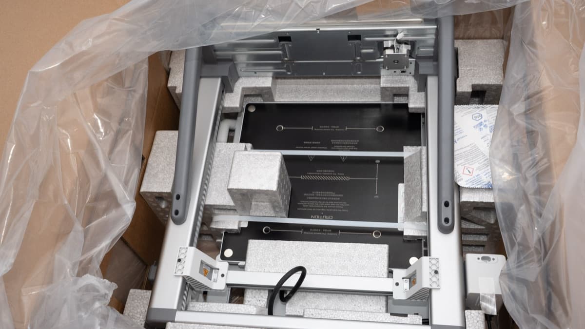 Foam trays holding printer subassemblies, AMS Lite, and accessory kits
