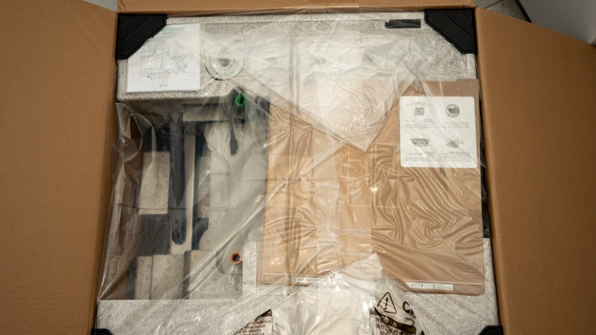 Top packaging layer inside the box with manuals and quick-start documentation