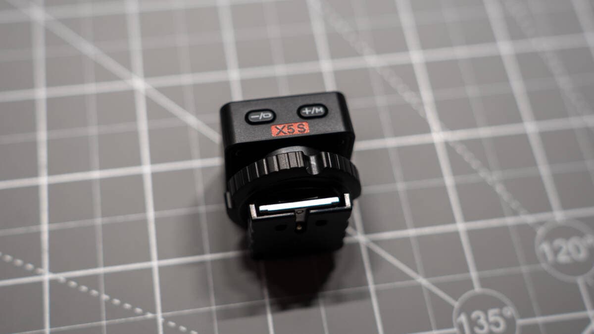 Front lens assembly featuring xenon flash tube and integrated LED modeling light