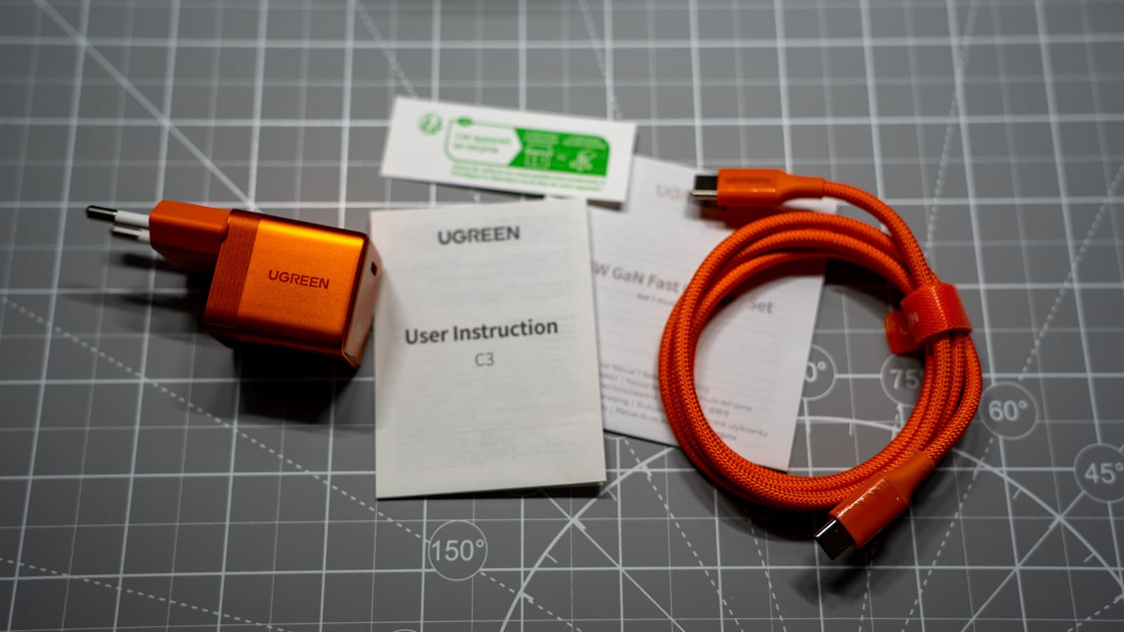 Unboxing the Nexode Air 65W showing the included 100W braided cable — Photo: Sergey Kuznetsov