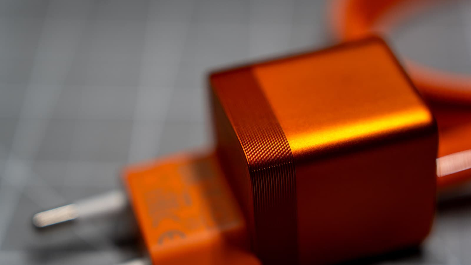 Nexode Air 65W powering an ultraportable laptop at a desk workspace — Photo: Sergey Kuznetsov