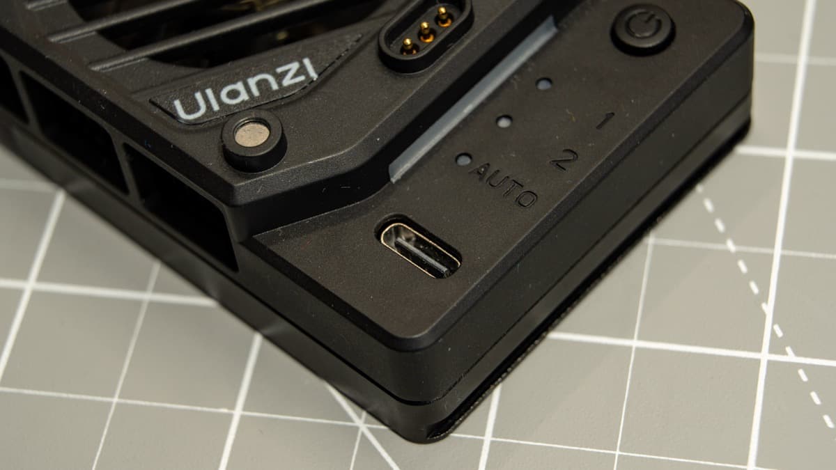 Side controls including USB-C input port, power button, and mode indicator LEDs
