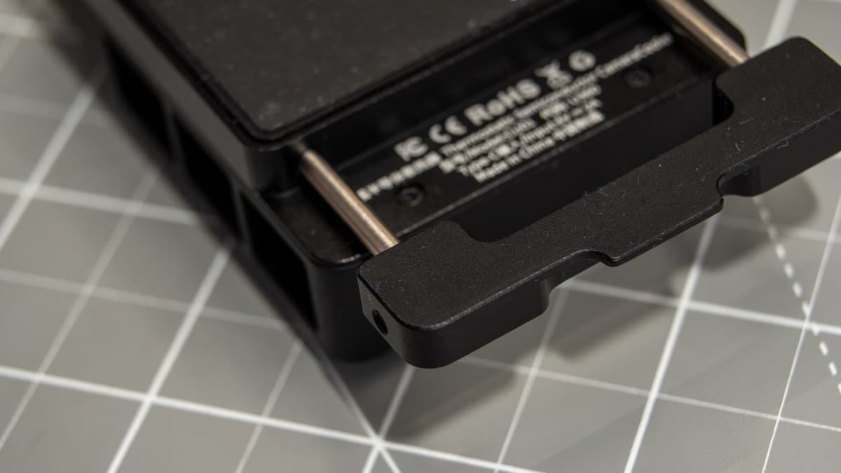 Spring-loaded mounting clamp mechanism with precision dual stainless steel guide rails