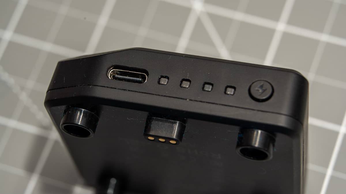 Detachable 3,000mAh battery pack showing USB-C port, 4-stage LED gauge, and power check button